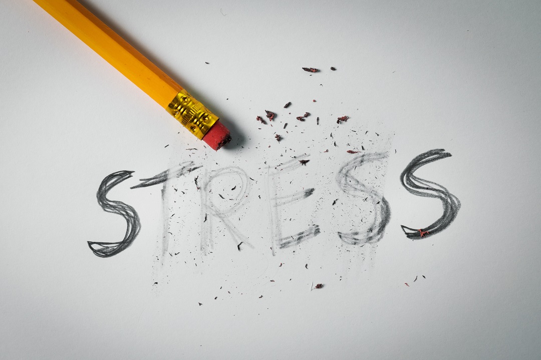 pencil erasing the word STRESS