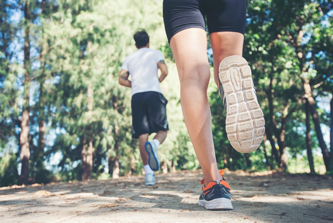 image of two people running outdoors