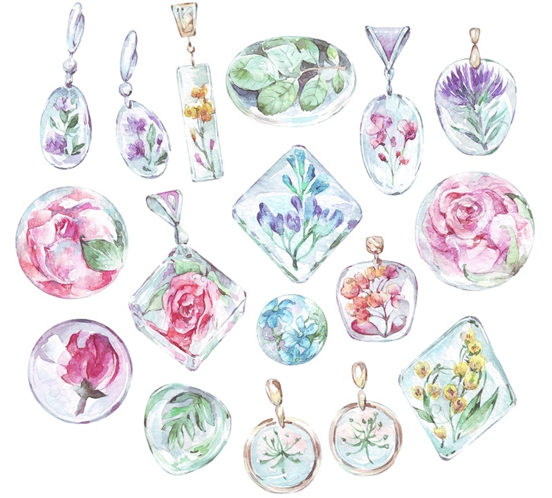 Image of pieces of resin jewelry with flowers embedded. Pieces include earrings and pendants for necklaces. White background.