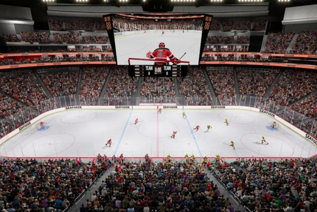 Photo of professional hockey rink with lots of fans in the stands and a goalie shown on the Jumbotron screen