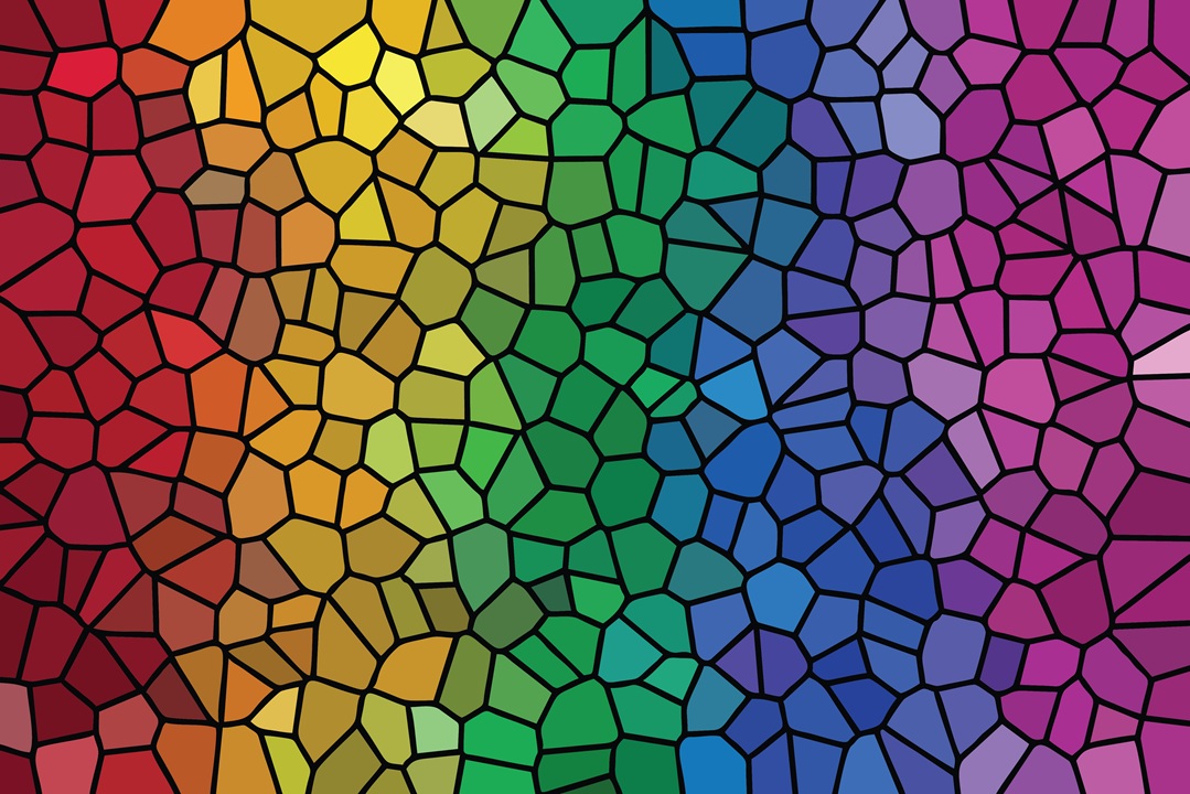 Image of stained glass ranging in color from red to yellow to green to blue to pink to purple