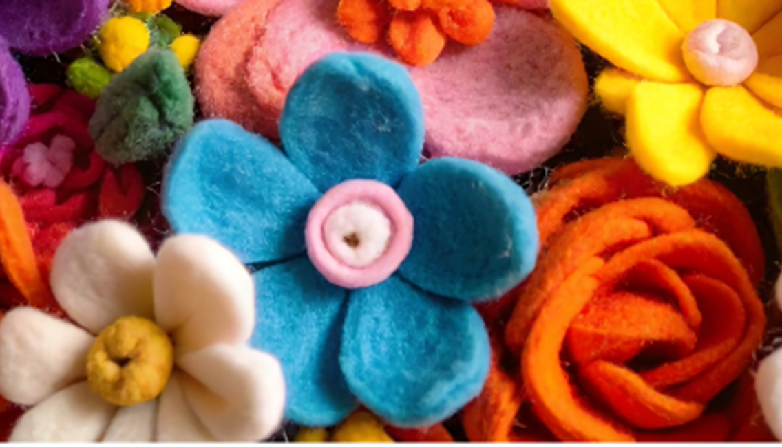Image of flowers in a variety of colors, made out of felt, and to be used to make key chains