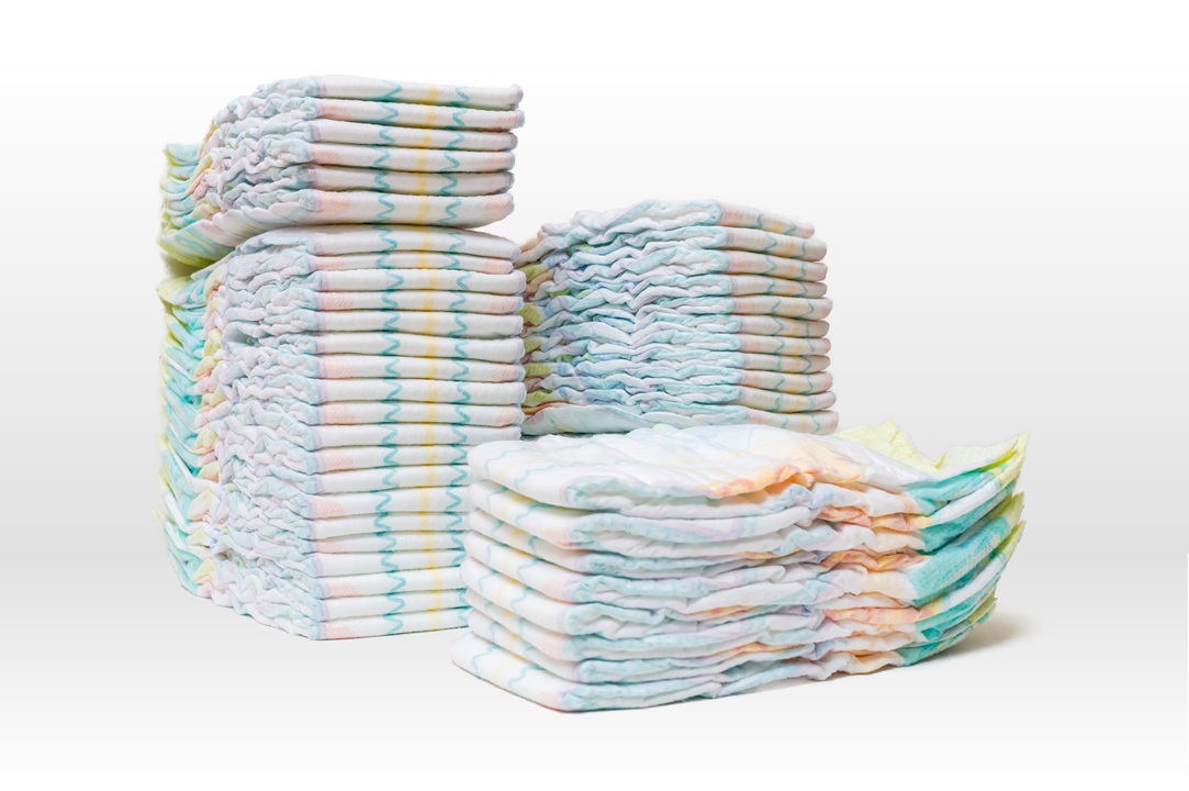 Photo of three stacks of diapers, different colors, sizes and height of stacks